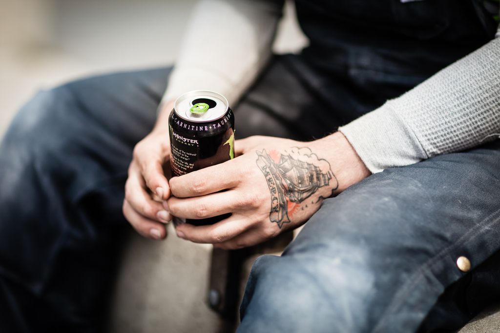 a man holding energy drink