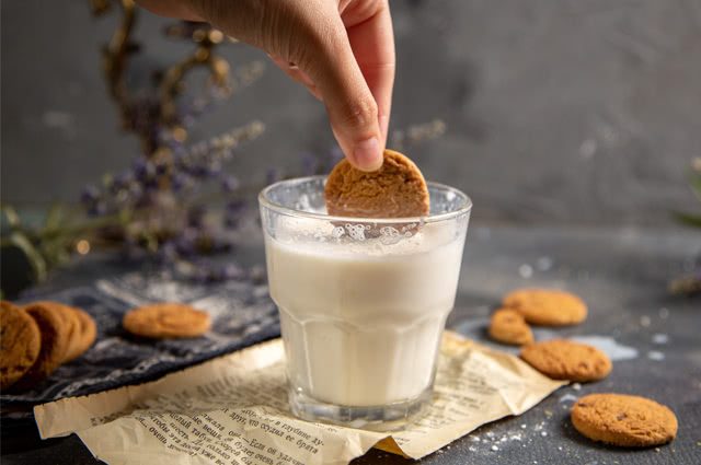 Milk, biscuits and processed in a glass