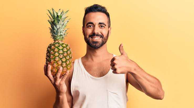 Man holding a Pineapple 