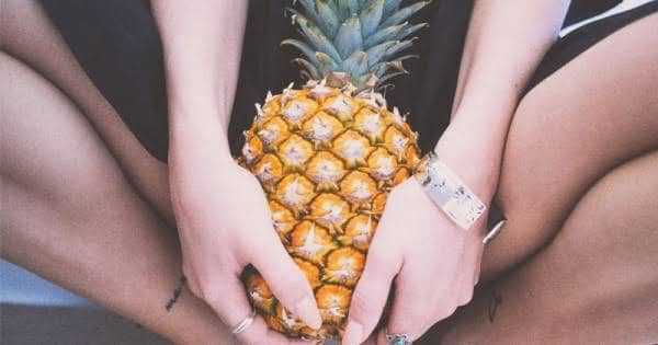 Woman holding Pineapple Sexually