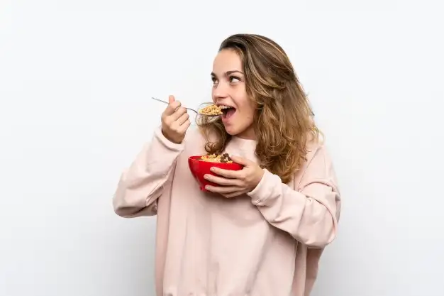 Lady Eating Guinea corn