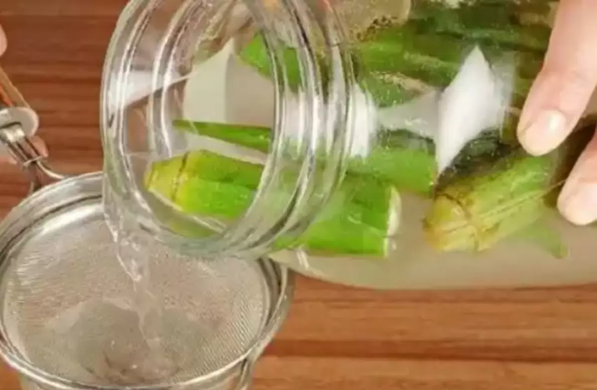 Filtering Okra water in a glass container